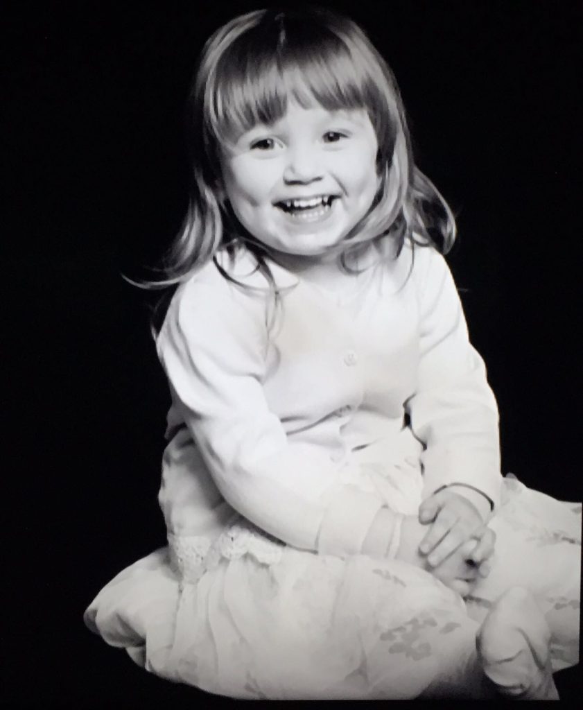 Smiling child with long hair