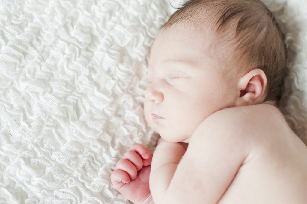 Sleeping baby on soft fabric
